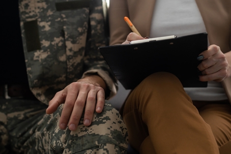 Uniformed service member sitting next to attorney